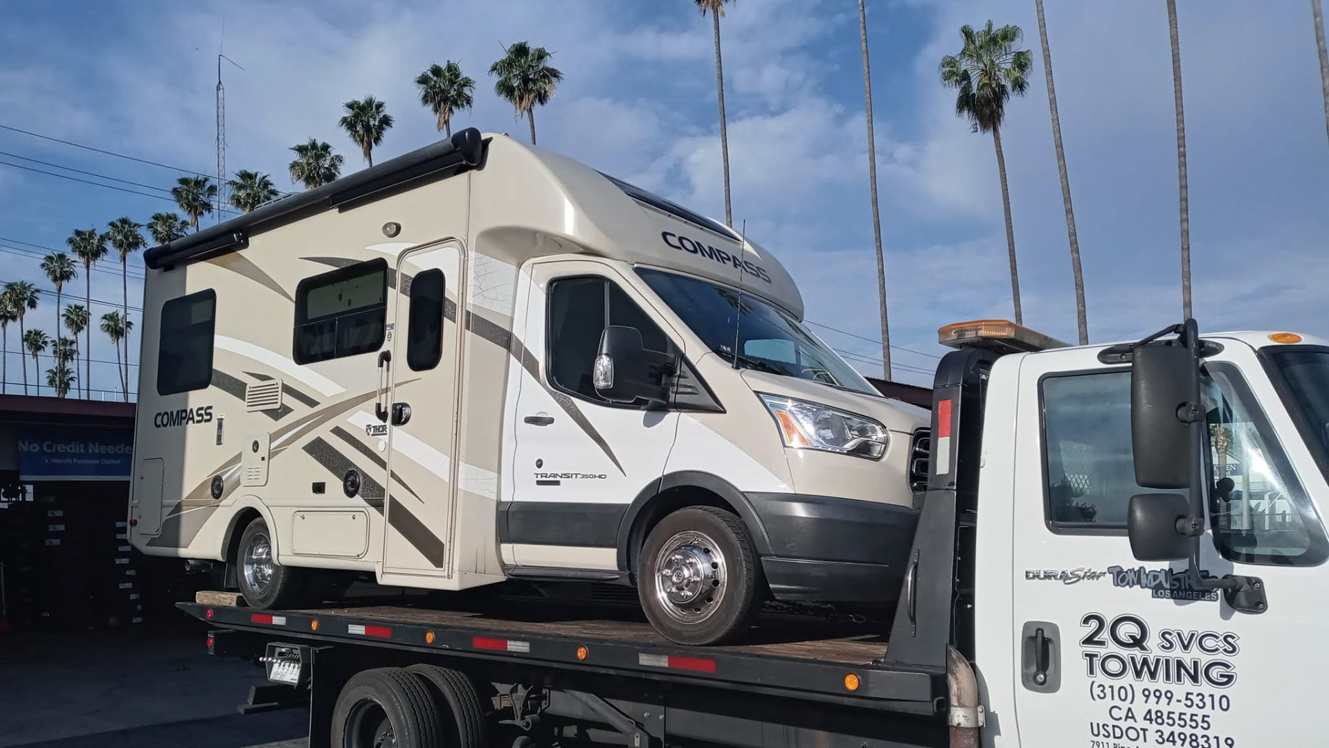 Thor Compass RV transported on a 2Q Svcs & Towing flatbed