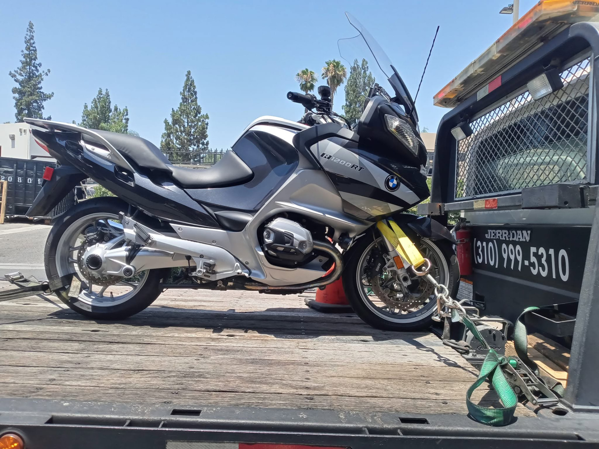 BMW R1200RT motorcycle strapped down on a 2Q Svcs & Towing flatbed